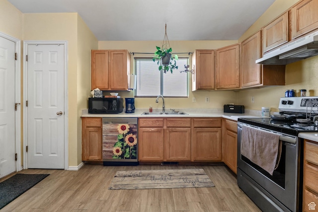 276 W 700 N, Tooele, UT 84074 - kitchen with electric stove, dishwashing machine, a sink, black microwave, and under cabinet range hood