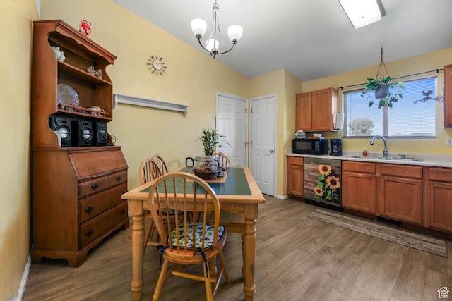 276 W 700 N, Tooele, UT 84074 - kitchen featuring dishwasher, a sink, black microwave, and light wood-style floors