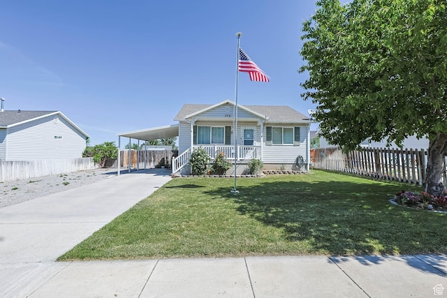 276 W 700 N, Tooele, UT 84074 - view of front of home featuring driveway, covered porch, and an attached carport