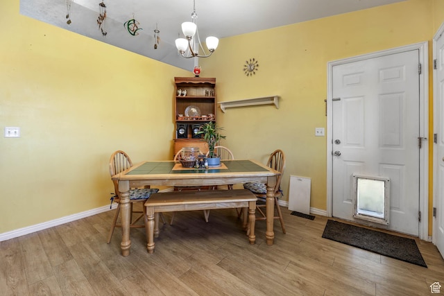 276 W 700 N, Tooele, UT 84074 - dining space featuring a chandelier, light wood finished floors, and baseboards