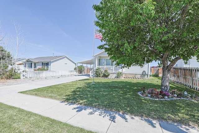 276 W 700 N, Tooele, UT 84074 - view of front of home featuring a porch, concrete driveway, and an attached carport