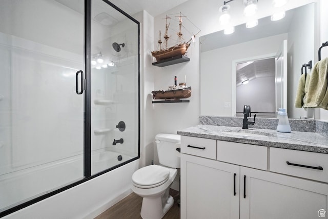 15002 S Wild Horse Way, Bluffdale, UT 84065 - full bath featuring vanity, toilet, shower / bath combination with glass door, and wood finished floors