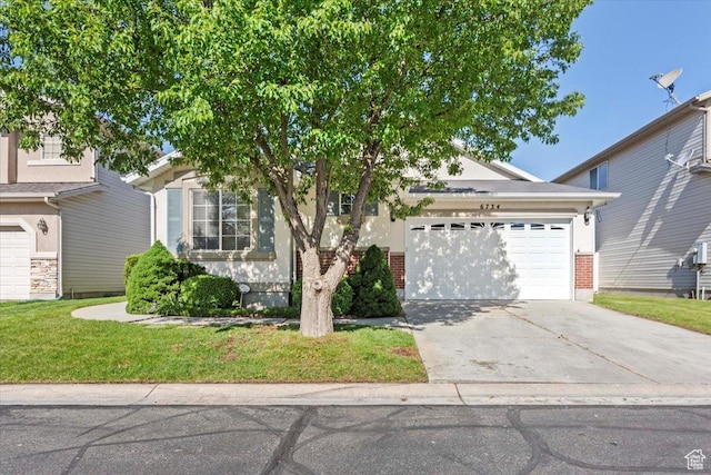 6734 S Firenze Pl, West Jordan, UT 84081 - obstructed view of property featuring an attached garage, driveway, a front lawn, and brick siding