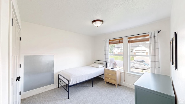 918 S River Ridge Lane, Spanish Fork, UT 84660 - bedroom featuring light colored carpet, a textured ceiling, and baseboards