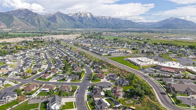 918 S River Ridge Lane, Spanish Fork, UT 84660 - aerial overview of property's location with a mountain backdrop and nearby suburban area
