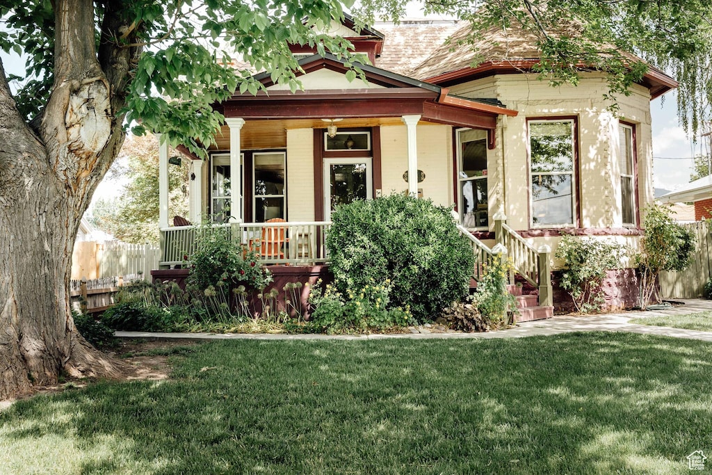 1423 S 400 E, Salt Lake City, UT 84115 - victorian home featuring a porch