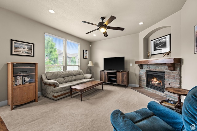 4117 W Shady Plum Way S, Jordan, UT 84009 - living room featuring a ceiling fan, a stone fireplace, recessed lighting, light carpet, and baseboards