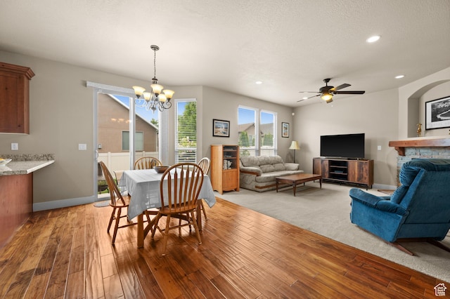 4117 W Shady Plum Way S, Jordan, UT 84009 - dining room featuring a chandelier, light wood-style floors, ceiling fan, recessed lighting, and baseboards