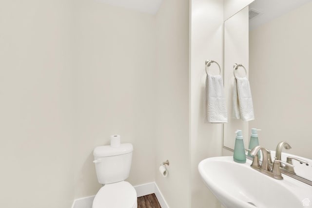11379 S Oakmond Rd, South Jordan, UT 84009 - half bathroom with a sink, toilet, baseboards, and wood finished floors
