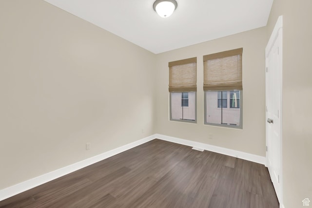 11379 S Oakmond Rd, South Jordan, UT 84009 - empty room featuring baseboards and dark wood-type flooring
