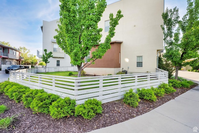 11379 S Oakmond Rd, South Jordan, UT 84009 - view of side of property with stucco siding and a fenced front yard