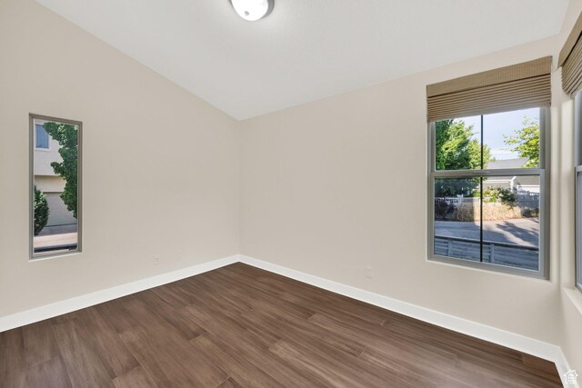 11379 S Oakmond Rd, South Jordan, UT 84009 - unfurnished room featuring baseboards, dark wood-style floors, and vaulted ceiling