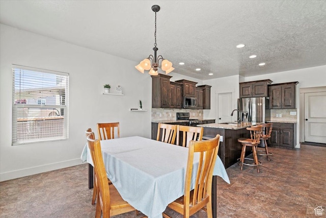 449 Travertine Way, Santaquin, UT 84655 - dining room featuring a chandelier, recessed lighting, a textured ceiling, and baseboards
