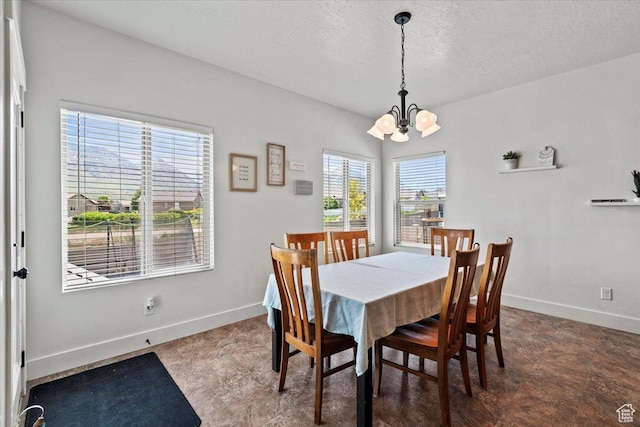 449 Travertine Way, Santaquin, UT 84655 - dining space featuring a chandelier, baseboards, and a textured ceiling