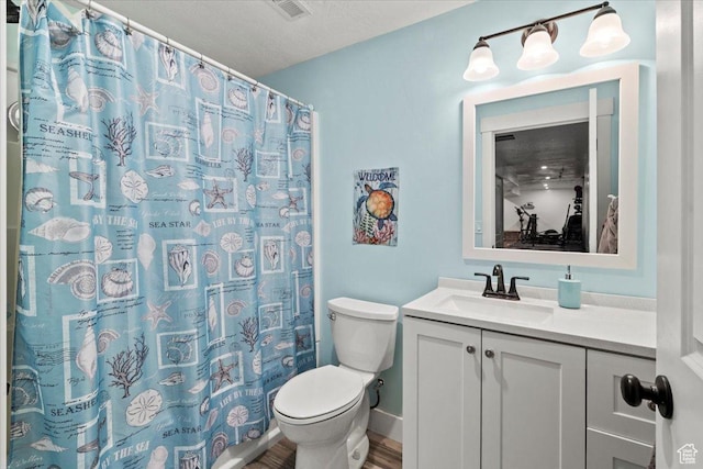 449 Travertine Way, Santaquin, UT 84655 - bathroom with toilet, vanity, baseboards, a shower with shower curtain, and wood finished floors
