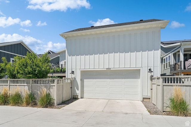 11051 S Mission Oaks Dr W, South Jordan, UT 84009 - view of front facade featuring board and batten siding, a garage, and concrete driveway