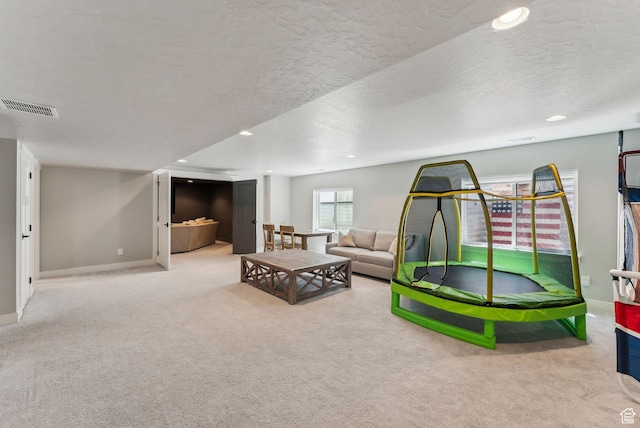11051 S Mission Oaks Dr W, South Jordan, UT 84009 - recreation room featuring carpet floors, baseboards, a textured ceiling, and recessed lighting