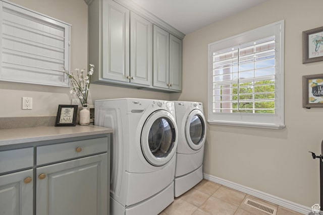 3330 N 175 W, North Ogden, UT 84414 - laundry room with cabinet space, washing machine and dryer, baseboards, and light tile patterned floors