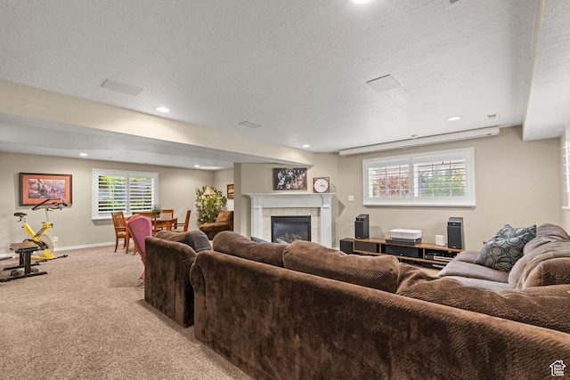3330 N 175 W, North Ogden, UT 84414 - living room with light colored carpet, a tiled fireplace, recessed lighting, a textured ceiling, and baseboards
