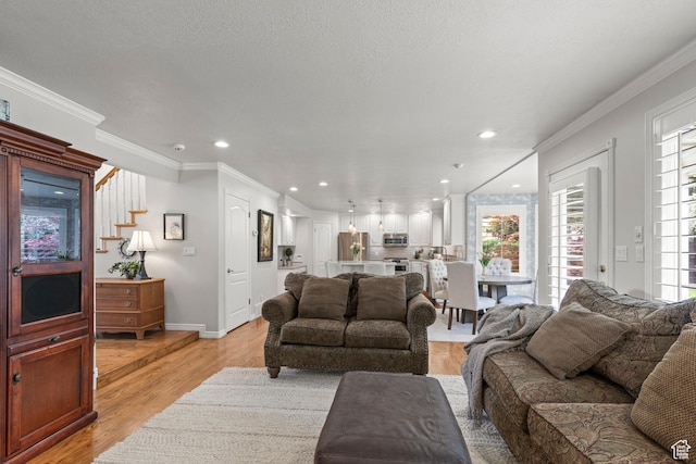 3330 N 175 W, North Ogden, UT 84414 - living room featuring healthy amount of natural light, light wood-type flooring, crown molding, recessed lighting, and baseboards
