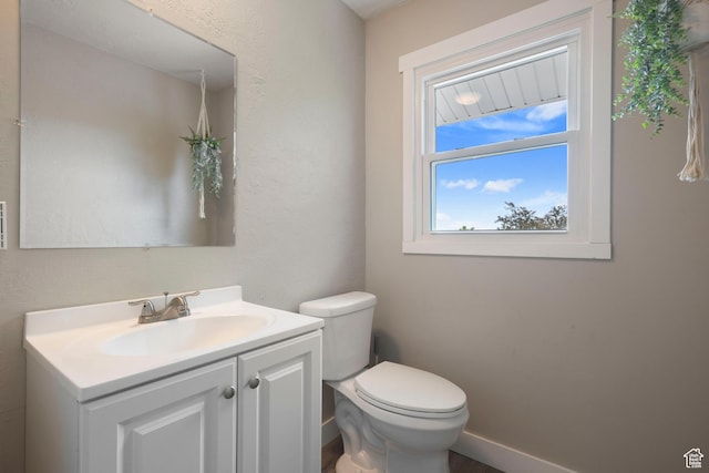761 N Highland Blvd, Brigham City, UT 84302 - bathroom featuring vanity, toilet, and baseboards