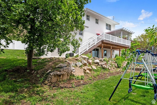 761 N Highland Blvd, Brigham City, UT 84302 - rear view of property featuring a deck, stairway, and a playground