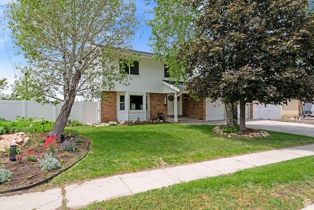 761 N Highland Blvd, Brigham City, UT 84302 - view of front of property with brick siding, driveway, and a garage