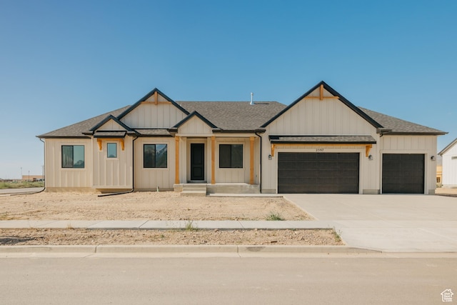2597 E 360 S Unit 16, Spanish Fork, UT 84660 - modern farmhouse style home featuring an attached garage, board and batten siding, concrete driveway, and roof with shingles