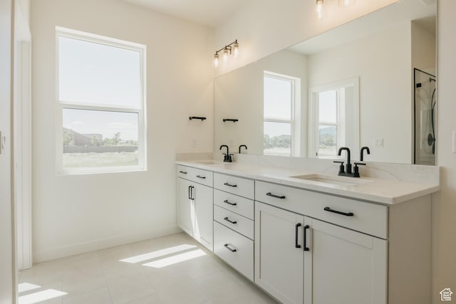 2597 E 360 S Unit 16, Spanish Fork, UT 84660 - full bath featuring healthy amount of natural light, double vanity, a shower, and tile patterned floors