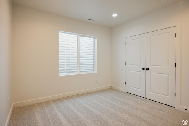 2597 E 360 S Unit 16, Spanish Fork, UT 84660 - unfurnished bedroom featuring baseboards, carpet flooring, a closet, and recessed lighting