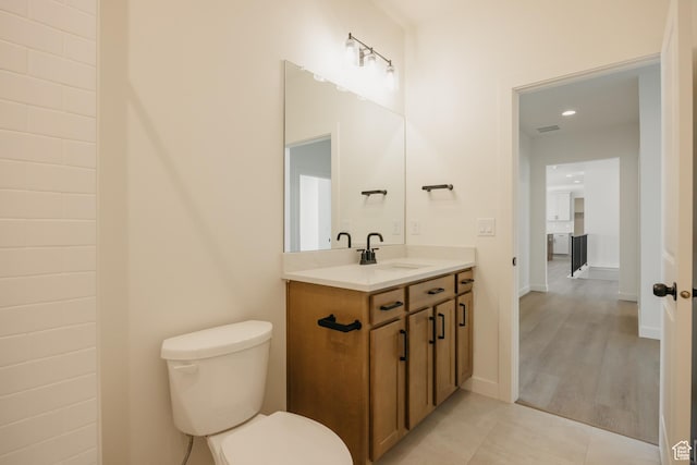 2597 E 360 S Unit 16, Spanish Fork, UT 84660 - bathroom featuring toilet, vanity, tile patterned floors, and recessed lighting