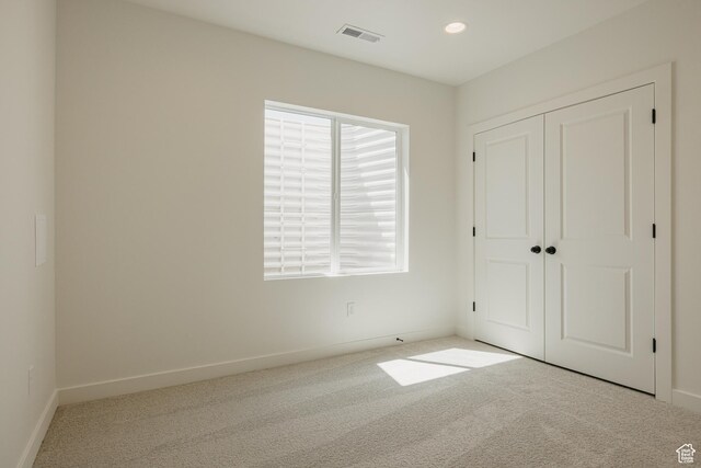 2597 E 360 S Unit 16, Spanish Fork, UT 84660 - unfurnished bedroom with carpet, baseboards, a closet, and recessed lighting