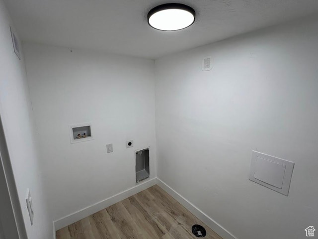 3222 W Tess Ave S, West Valley City, UT 84119 - washroom featuring hookup for a washing machine, light wood-type flooring, baseboards, and electric dryer hookup