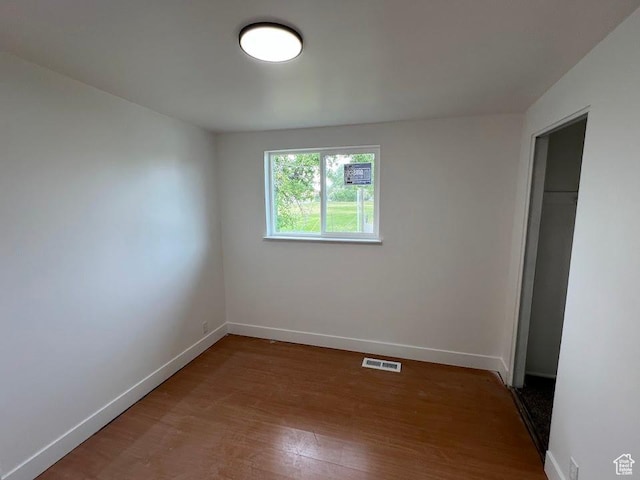 3222 W Tess Ave S, West Valley City, UT 84119 - unfurnished bedroom with baseboards, wood finished floors, and a closet
