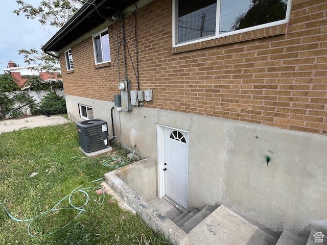 3222 W Tess Ave S, West Valley City, UT 84119 - view of side of home with central AC unit and brick siding
