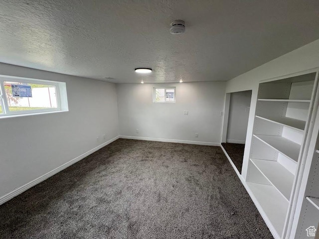 3222 W Tess Ave S, West Valley City, UT 84119 - unfurnished bedroom featuring carpet floors, a textured ceiling, and baseboards