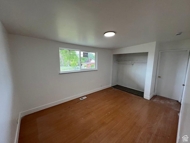 3222 W Tess Ave S, West Valley City, UT 84119 - unfurnished bedroom with wood finished floors, baseboards, and a closet