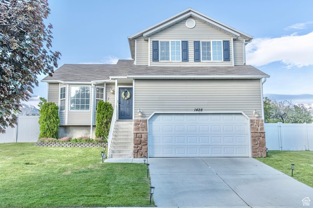 1428 N Reese Dr, Provo, UT 84601 - traditional-style home featuring an attached garage, concrete driveway, and stone siding