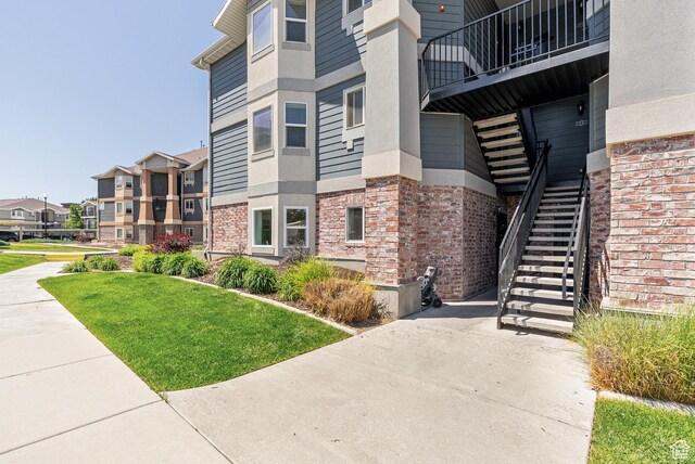 116 E Resaca Unit F3, Midvale, UT 84070 - view of property featuring stairway and a residential view