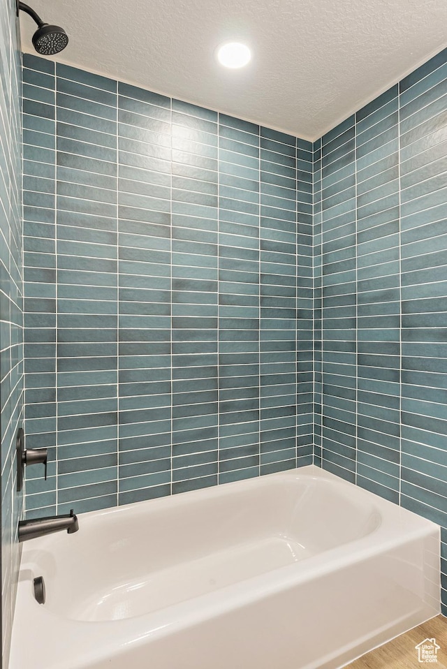116 E Resaca Unit F3, Midvale, UT 84070 - full bathroom featuring a textured ceiling, tub / shower combination, and recessed lighting