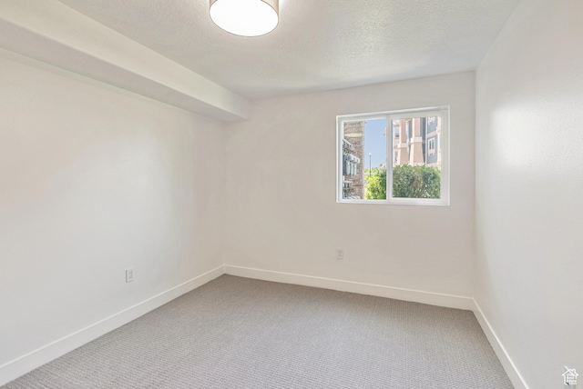 116 E Resaca Unit F3, Midvale, UT 84070 - carpeted spare room with baseboards and a textured ceiling