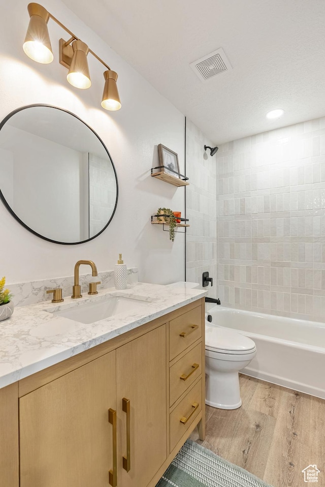 116 E Resaca Unit F3, Midvale, UT 84070 - bathroom with vanity, toilet, wood finished floors, and shower / tub combination