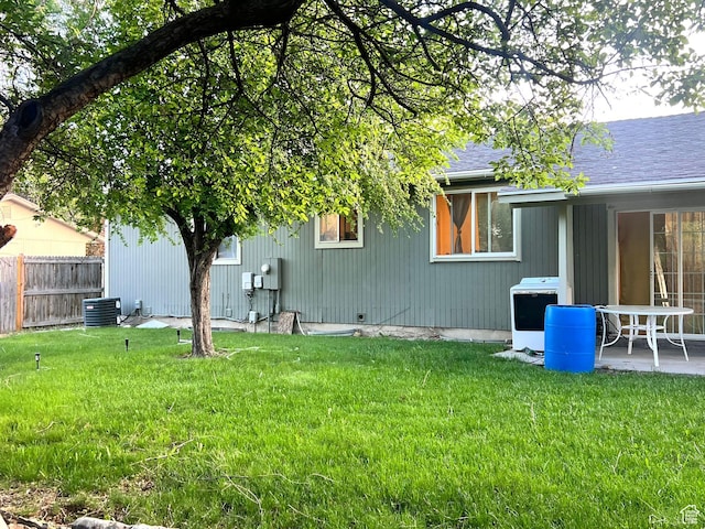 6439 S Clernates Dr, West Jordan, UT 84081 - back of house featuring central AC and roof with shingles