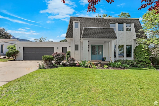 1507 Hudson St, Ogden, UT 84404 - view of front property with an attached garage, concrete driveway, and stucco siding