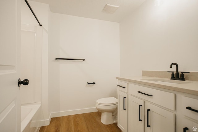 3537 E 1120 S Unit 110, Spanish Fork, UT 84660 - bathroom featuring vanity, wood finished floors, toilet, shower / tub combination, and baseboards