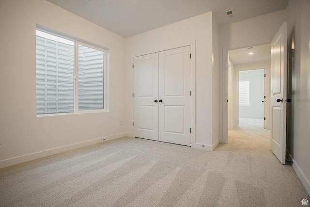 3537 E 1120 S Unit 110, Spanish Fork, UT 84660 - unfurnished bedroom featuring light colored carpet, baseboards, and a closet