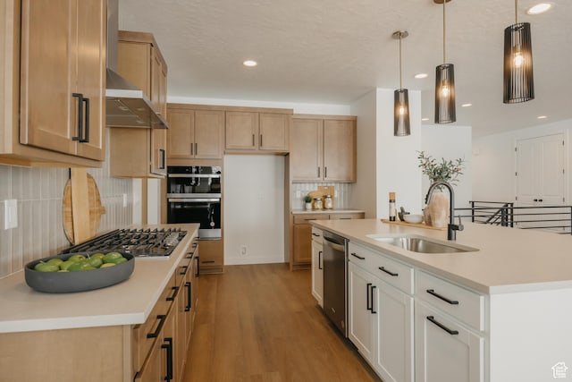 3537 E 1120 S Unit 110, Spanish Fork, UT 84660 - kitchen featuring a sink, stainless steel appliances, decorative backsplash, light wood-style flooring, and recessed lighting