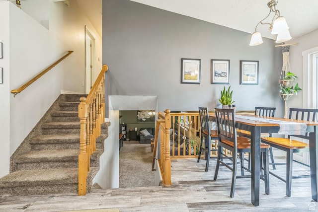 1135 E 220 N, Heber City, UT 84032 - dining area with wood finished floors, vaulted ceiling, and stairs