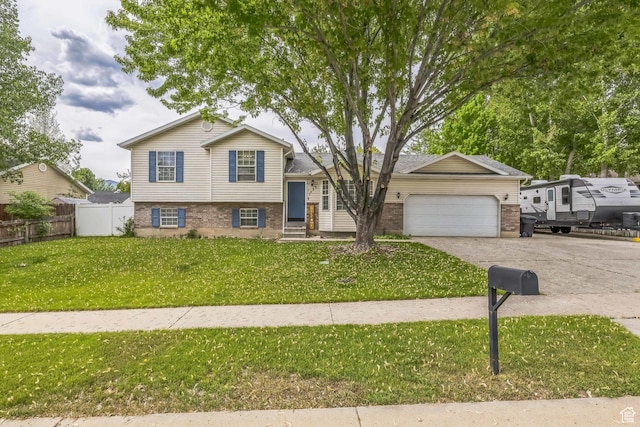 1135 E 220 N, Heber City, UT 84032 - split level home with brick siding, an attached garage, and driveway