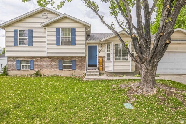 1135 E 220 N, Heber City, UT 84032 - tri-level home with a front yard, a garage, and brick siding